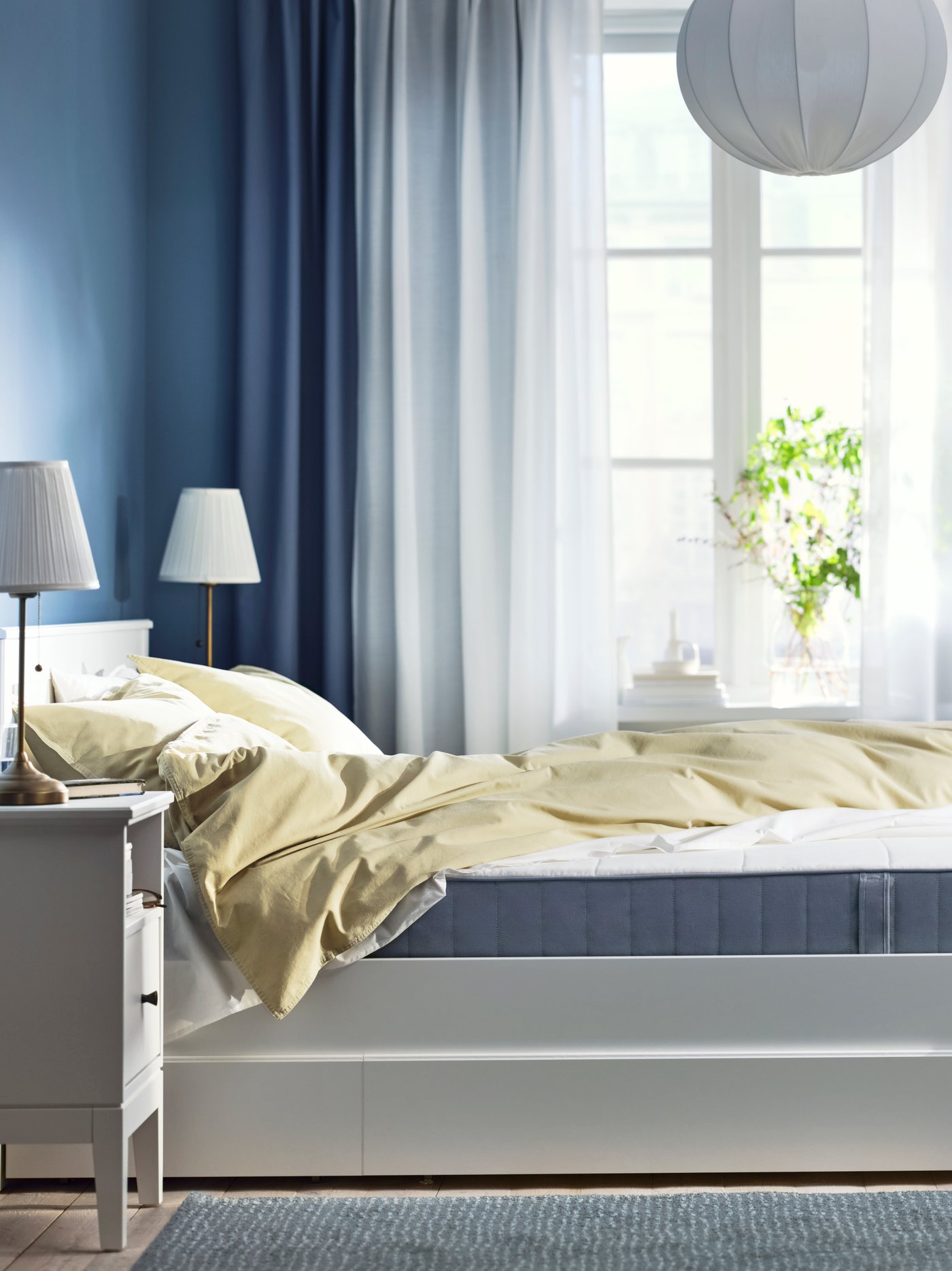 An extra firm/light blue VESTMARKA sprung mattress