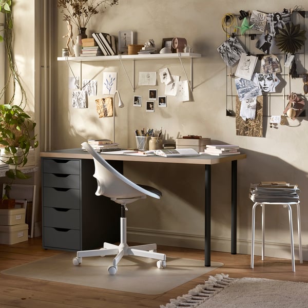 A grey/wood effect black ALEX desk