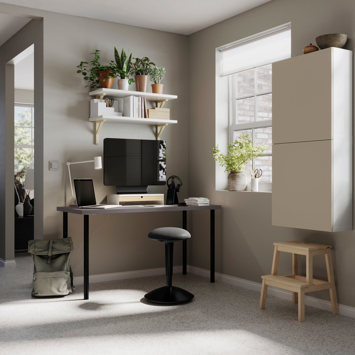 A dark grey/black LAGKAPTEN desk