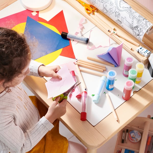 A wood LUSTIGT arts and crafts storage in the children's room