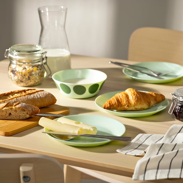 A light green OFTAST side plate