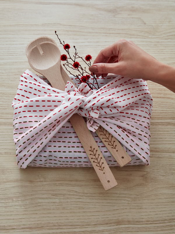 A patterned white/red VINTERFEST tea towel in the kitchen