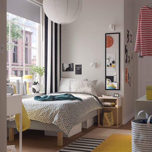 An yellow BLÅSVERK table lamp in the childrens room