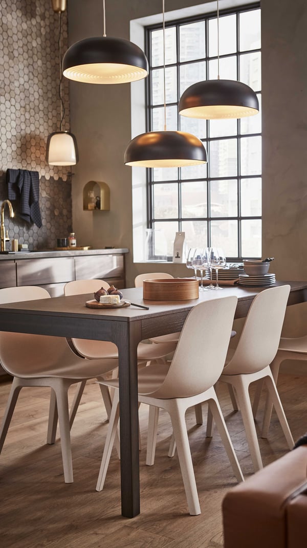 A dark brown EKEDALEN extendable table in the dining room