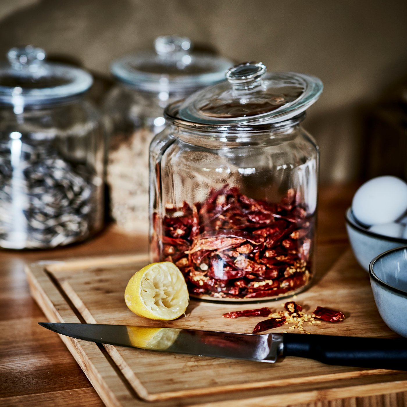 A clear glass VARDAGEN jar with lid