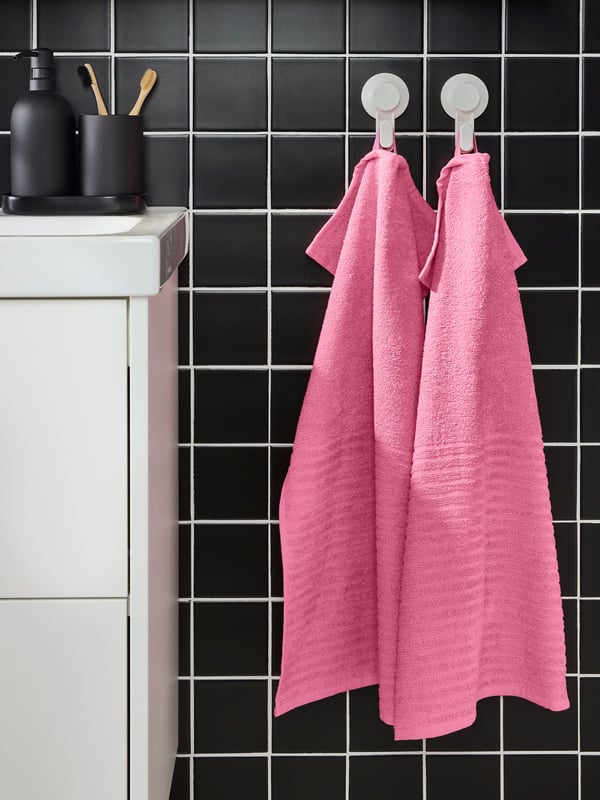 A pink VÅGSJÖN hand towel