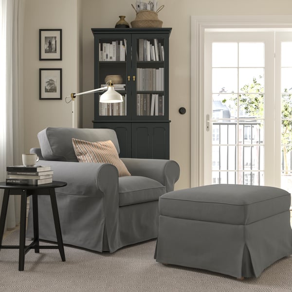 A Hakebo dark grey EKTORP armchair