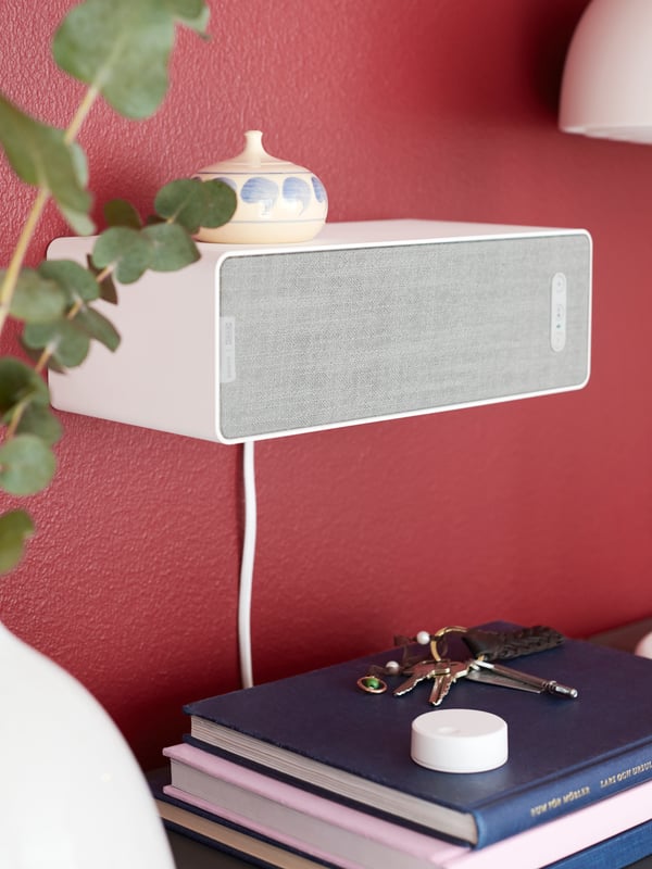 A white NYMÅNE table lamp in the living room
