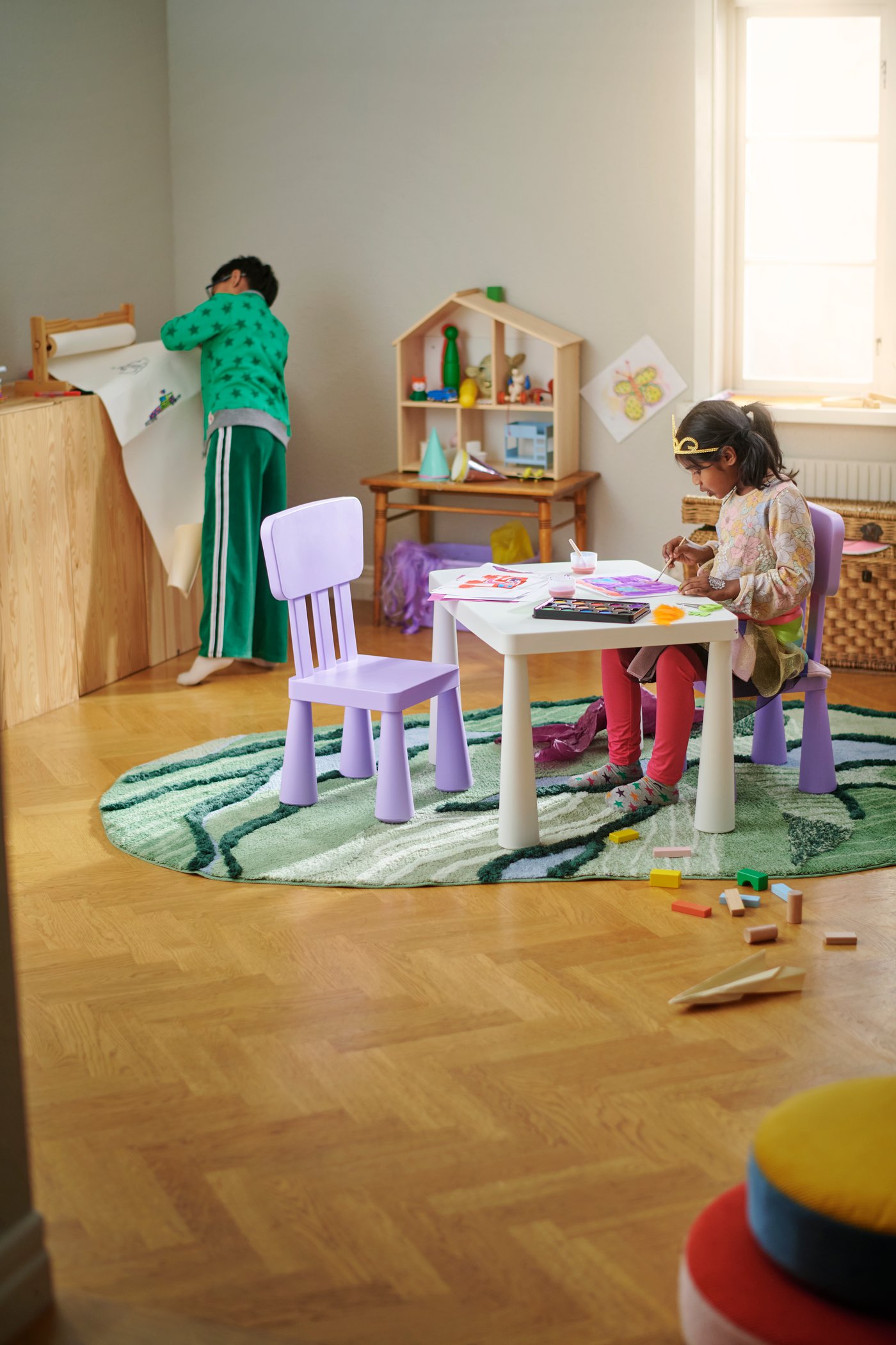 An in/outdoor white MAMMUT children's table in the childrens room