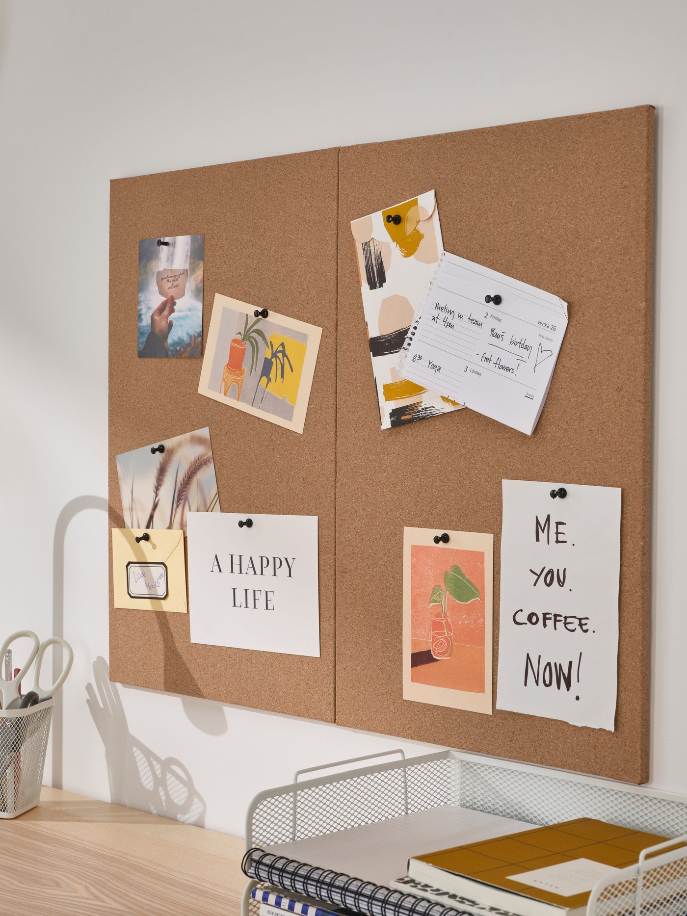 A cork FLÖNSA memo board with pins