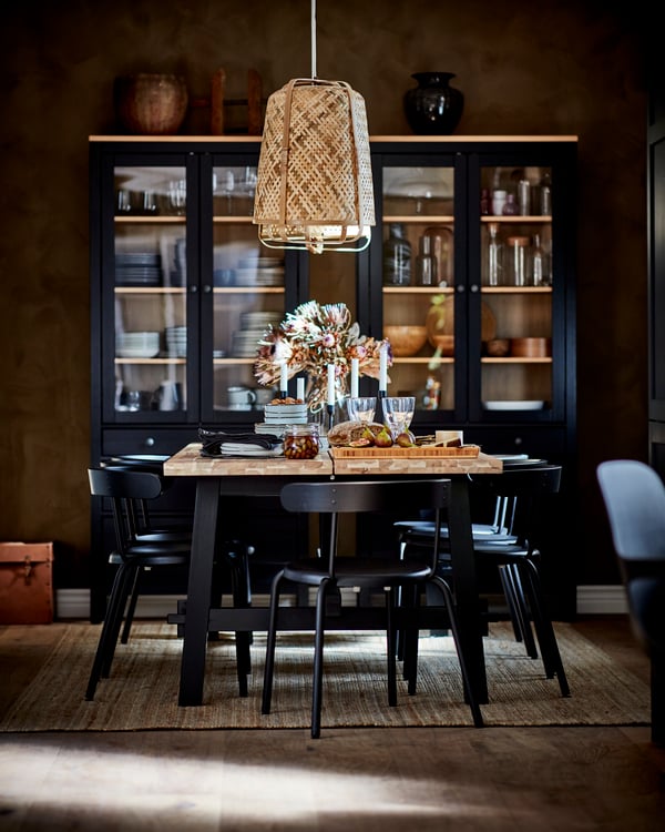 An acacia/black SKOGSTA dining table in the dining room
