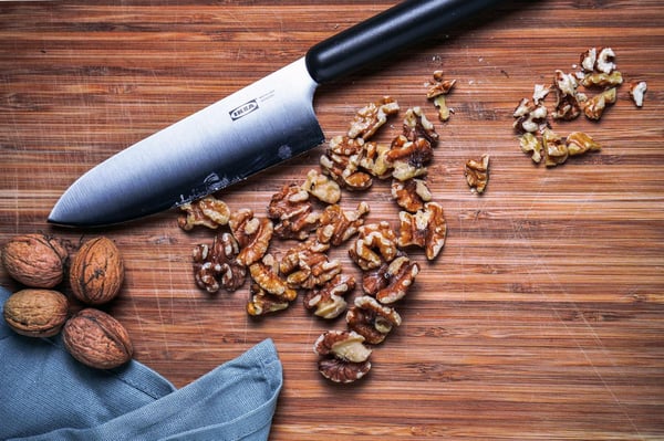 Roughly chop the walnuts with a knife