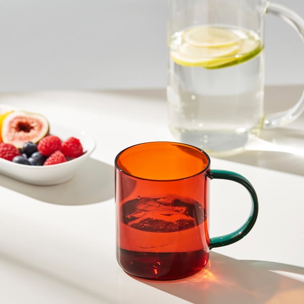 A mixed colours brown/green SKUGGSTUBB mug