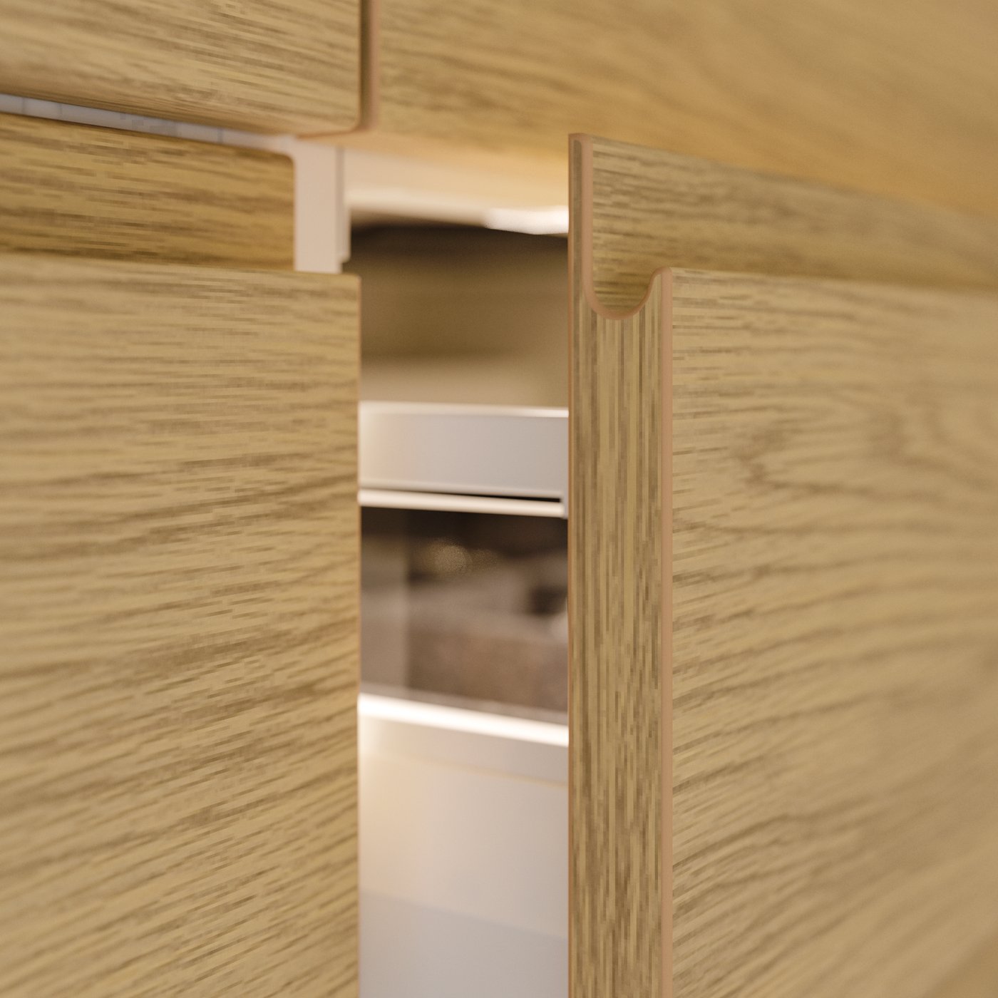 A VOXTORP kitchen drawer with oak effect.