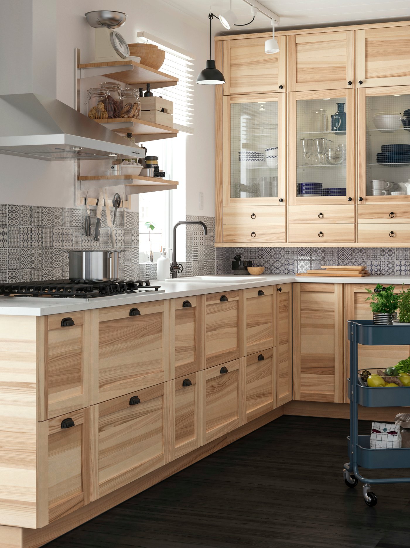 A brushed black metal GAMLESJÖN dual-control kitchen mixer tap in the kitchen