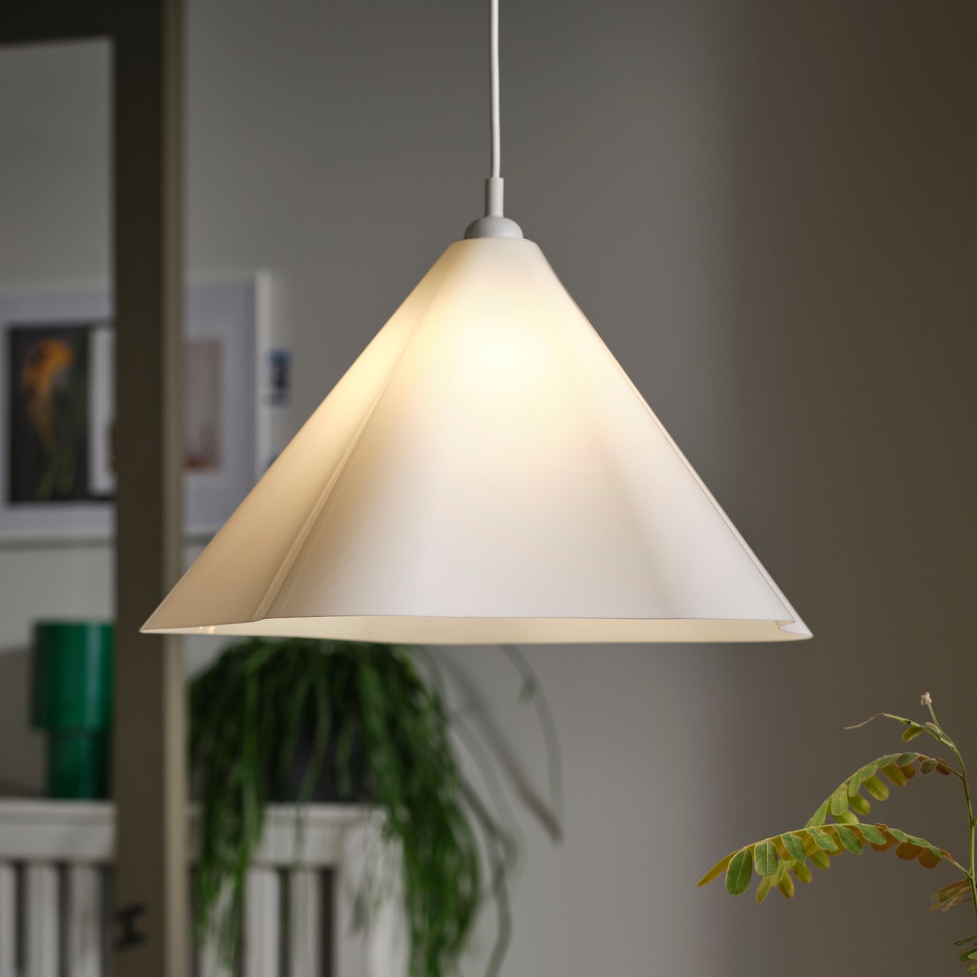 A white/plastic ZEBRASÄV pendant lamp in the dining room