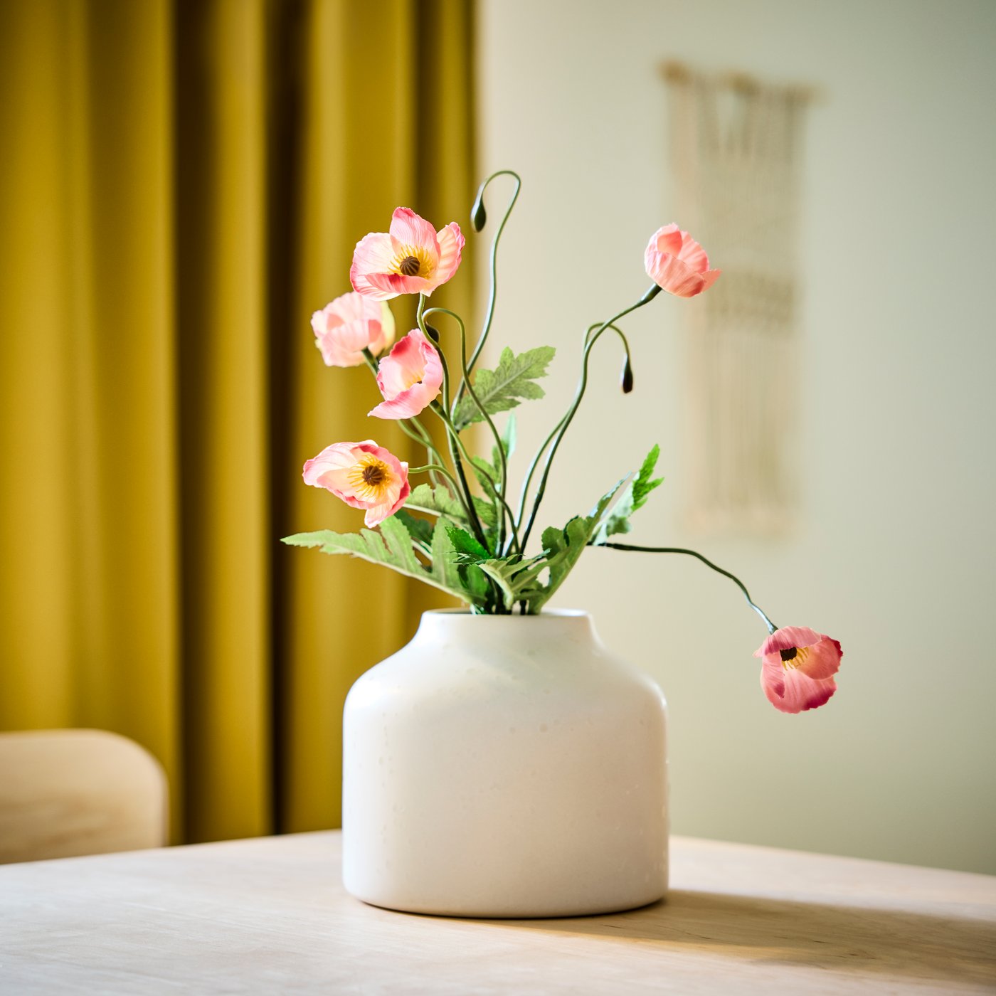 Artificial floral arrangement in vase