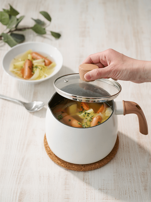 A non-stick coating/white MANGOFISK saucepan with lid