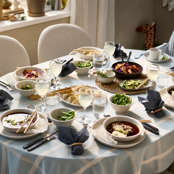 A natural/seagrass IHÅLLIG place mat in the dining room