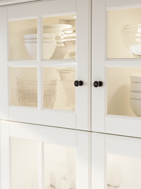 An off-white BODBYN glass door
