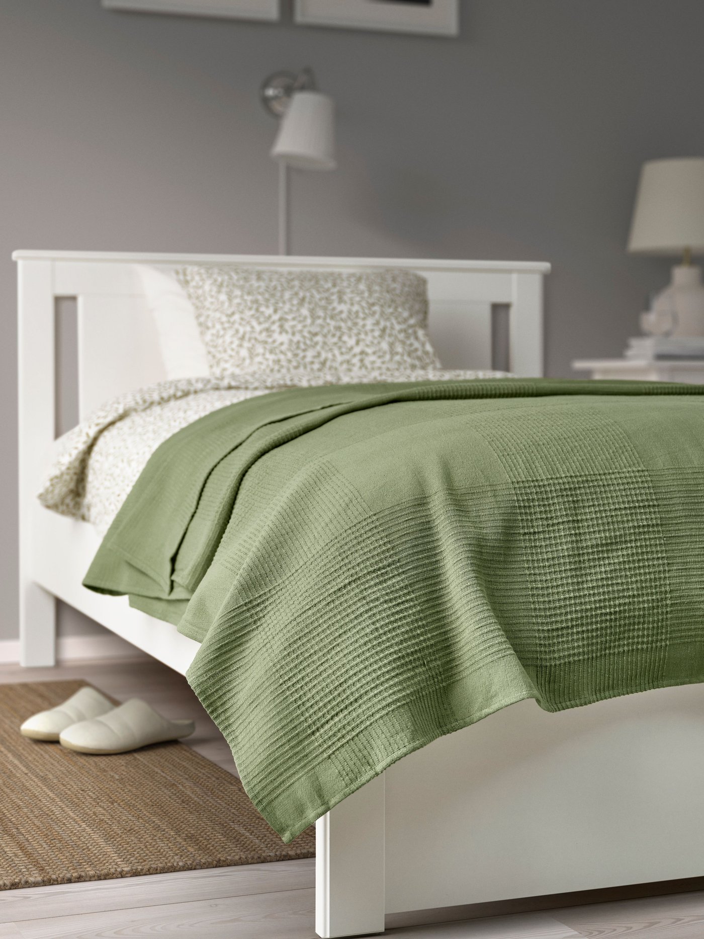 A white SONGESAND bed frame