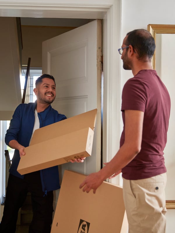 An IKEA coworker delivering an order