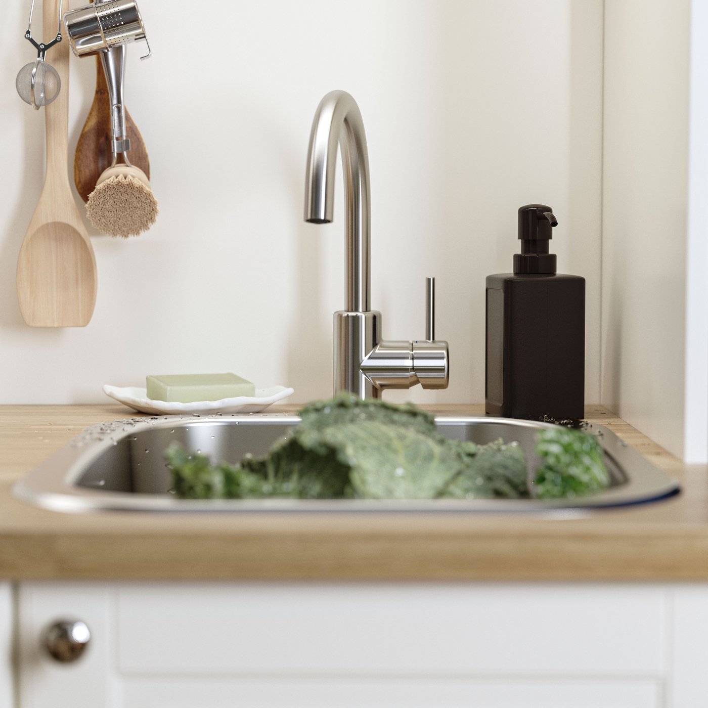 Un dispensador de sabó RINNIG de color gris.