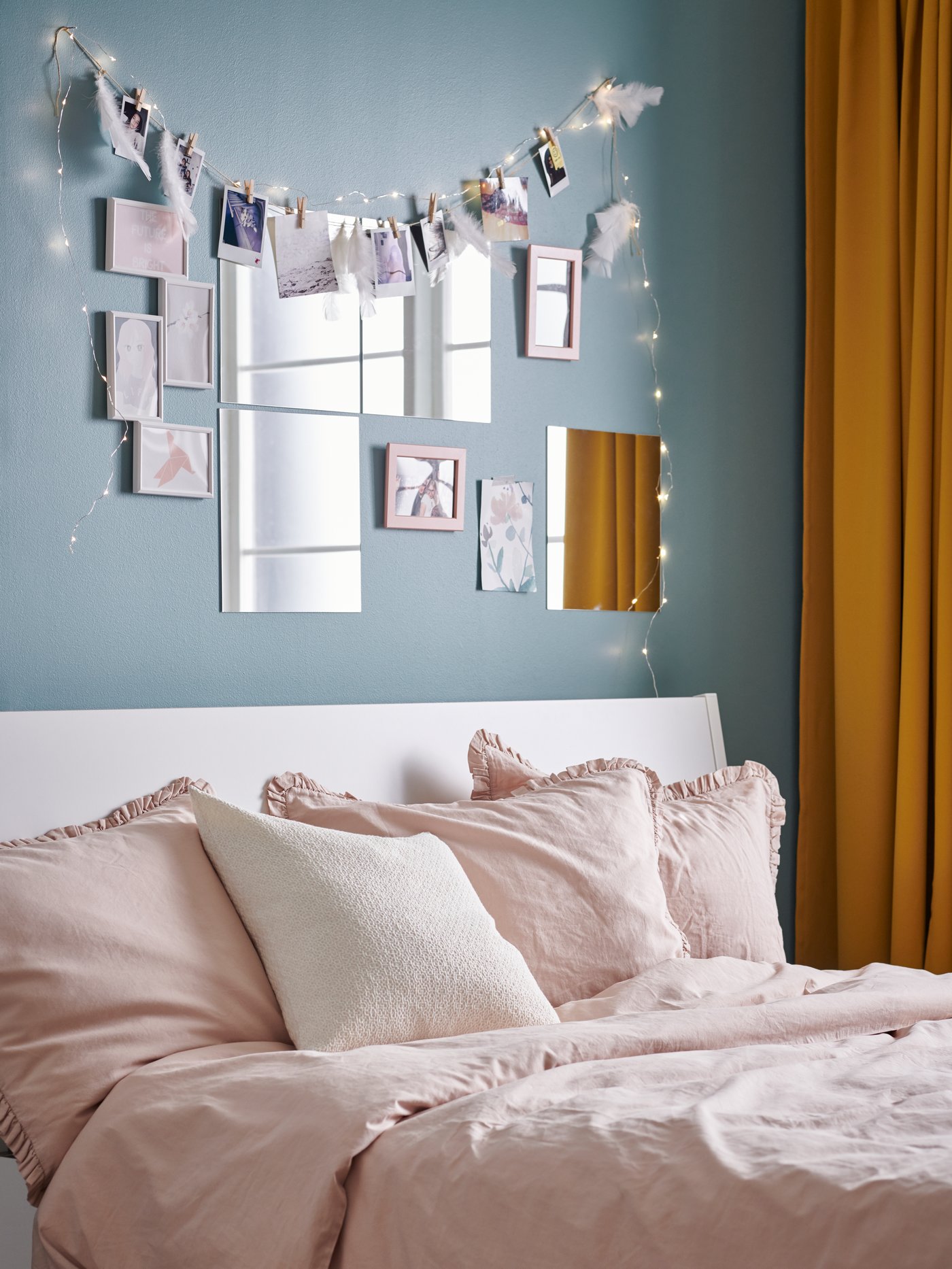 A white YLLEVAD collage frame for 4 photos in the bedroom