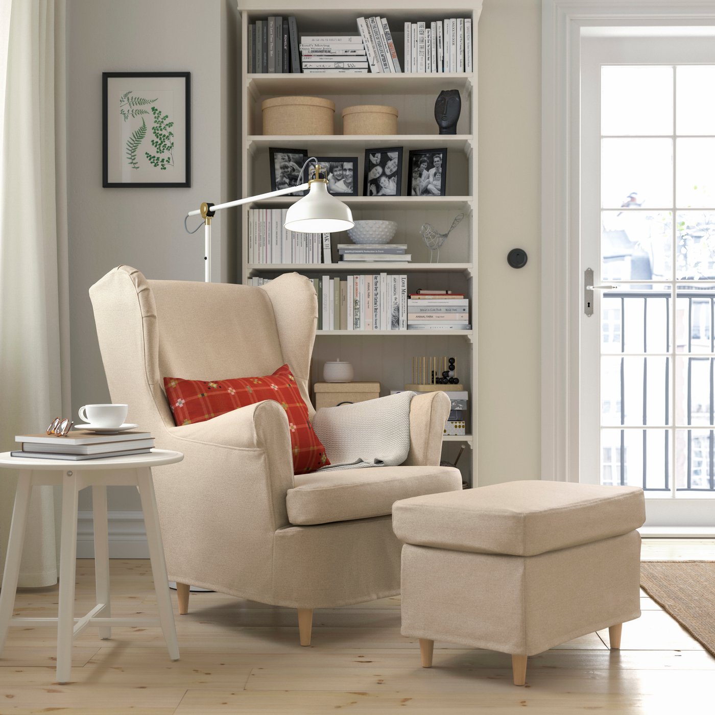 A Naggen beige STRANDMON slipcover for wing chair