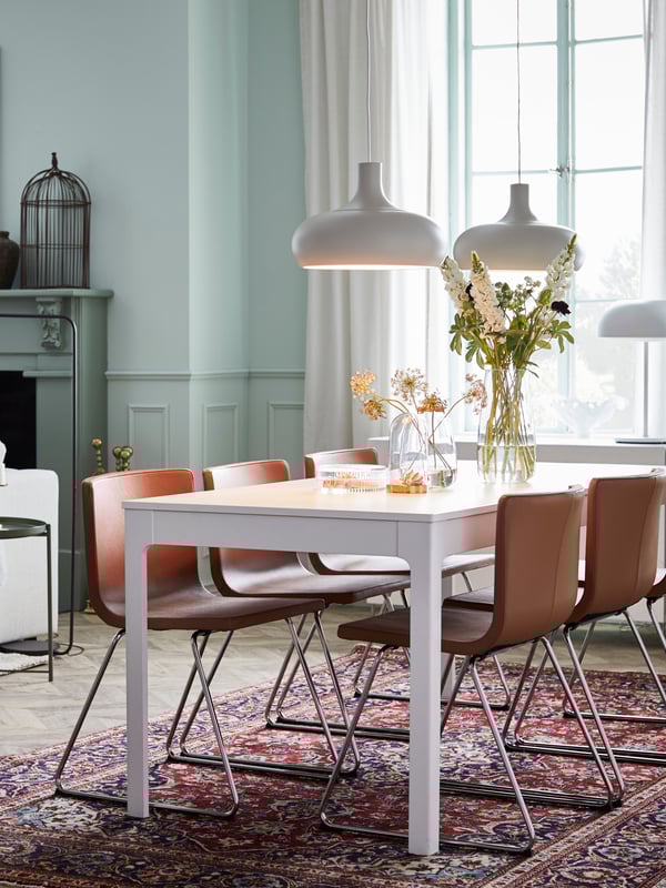 A handmade PERSISK MIX rug, low pile in the dining room