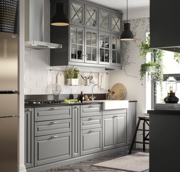 A chrome-plated EDSVIK dual-control kitchen mixer tap in the kitchen