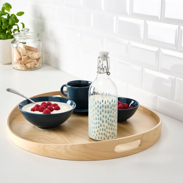 A patterned/blue KORKEN bottle with stopper