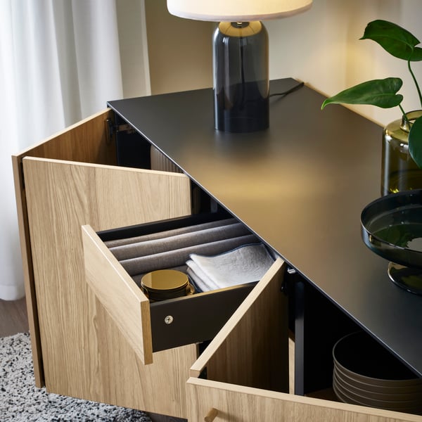 A black/oak veneer BOASTAD sideboard