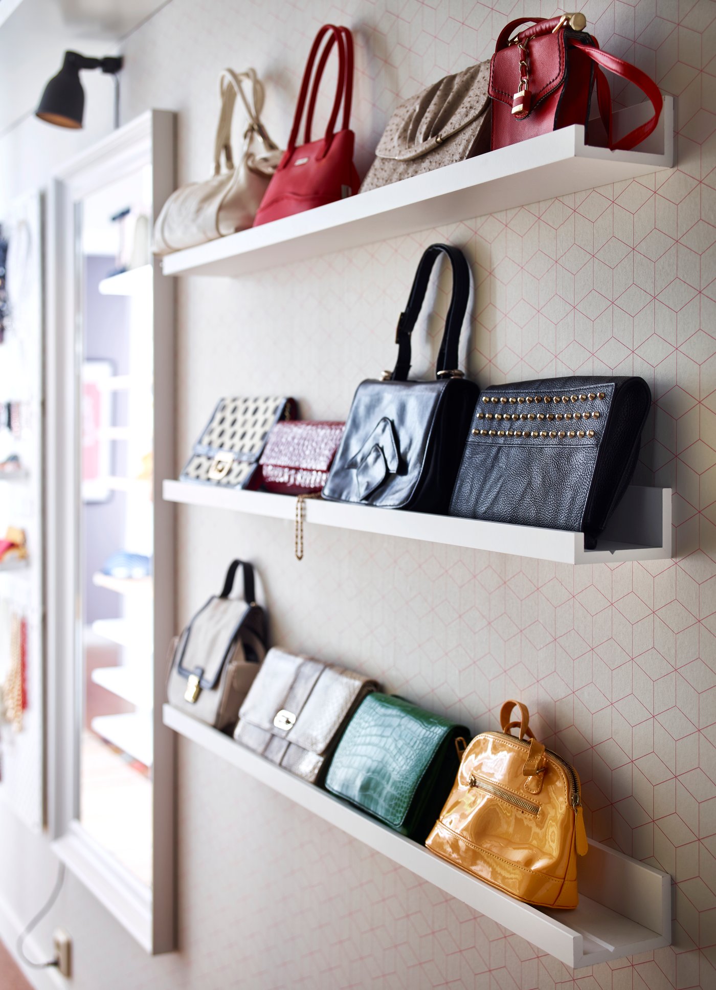 A white MOSSLANDA picture ledge in the bedroom