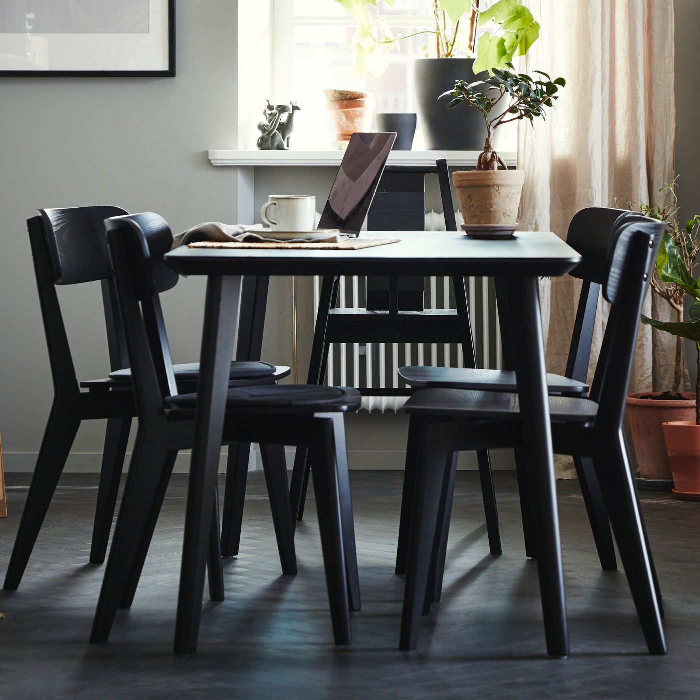 A black/ash veneer LISABO table in the dining room