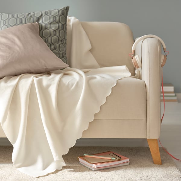 An off-white THORGUN throw