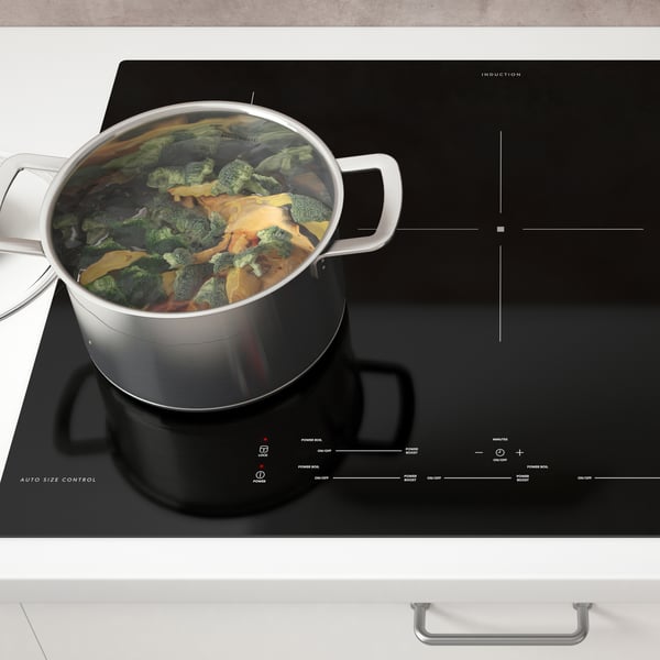 A black SÄRKLASSIG induction cooktop in the kitchen