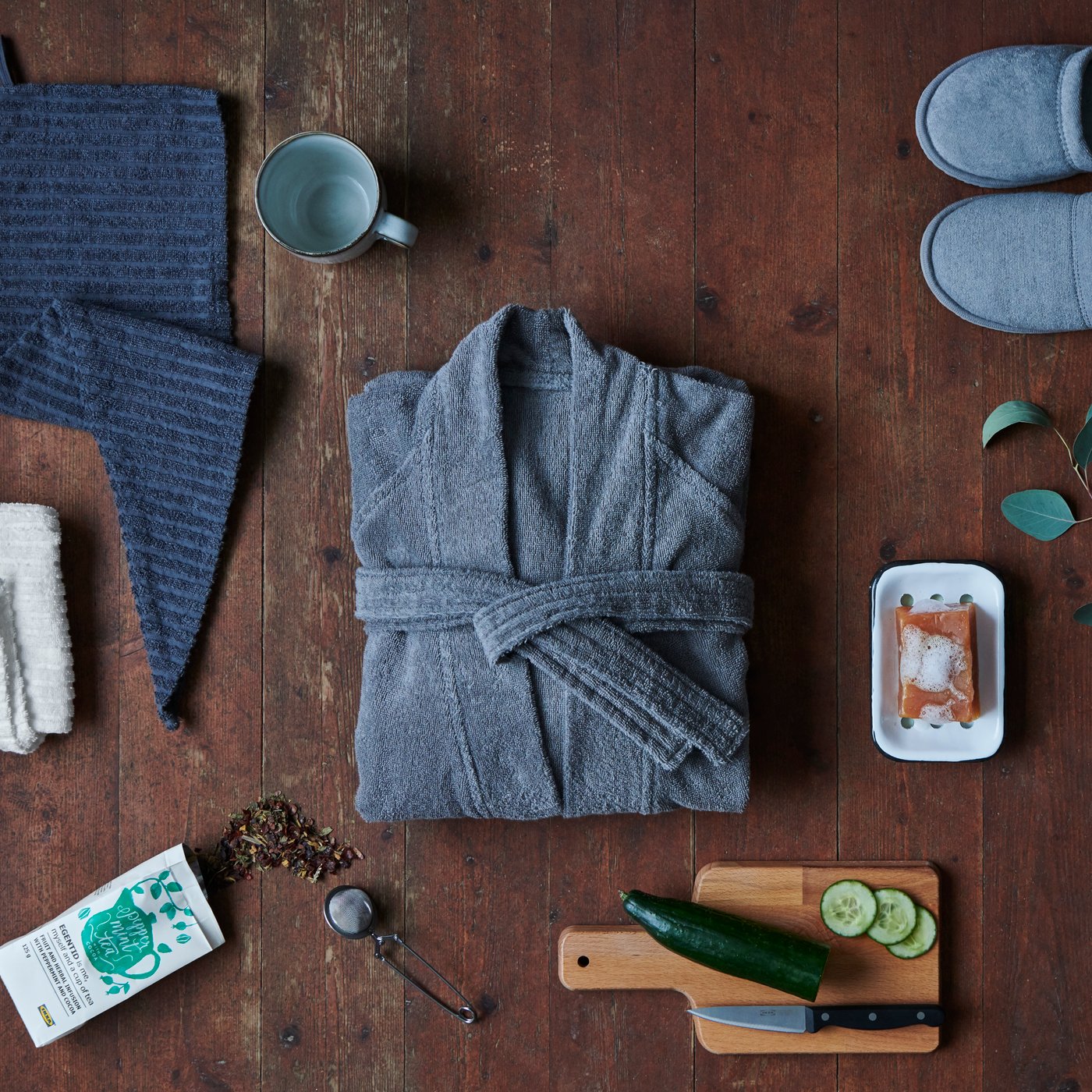 A grey TÅSJÖN slippers in the bathroom