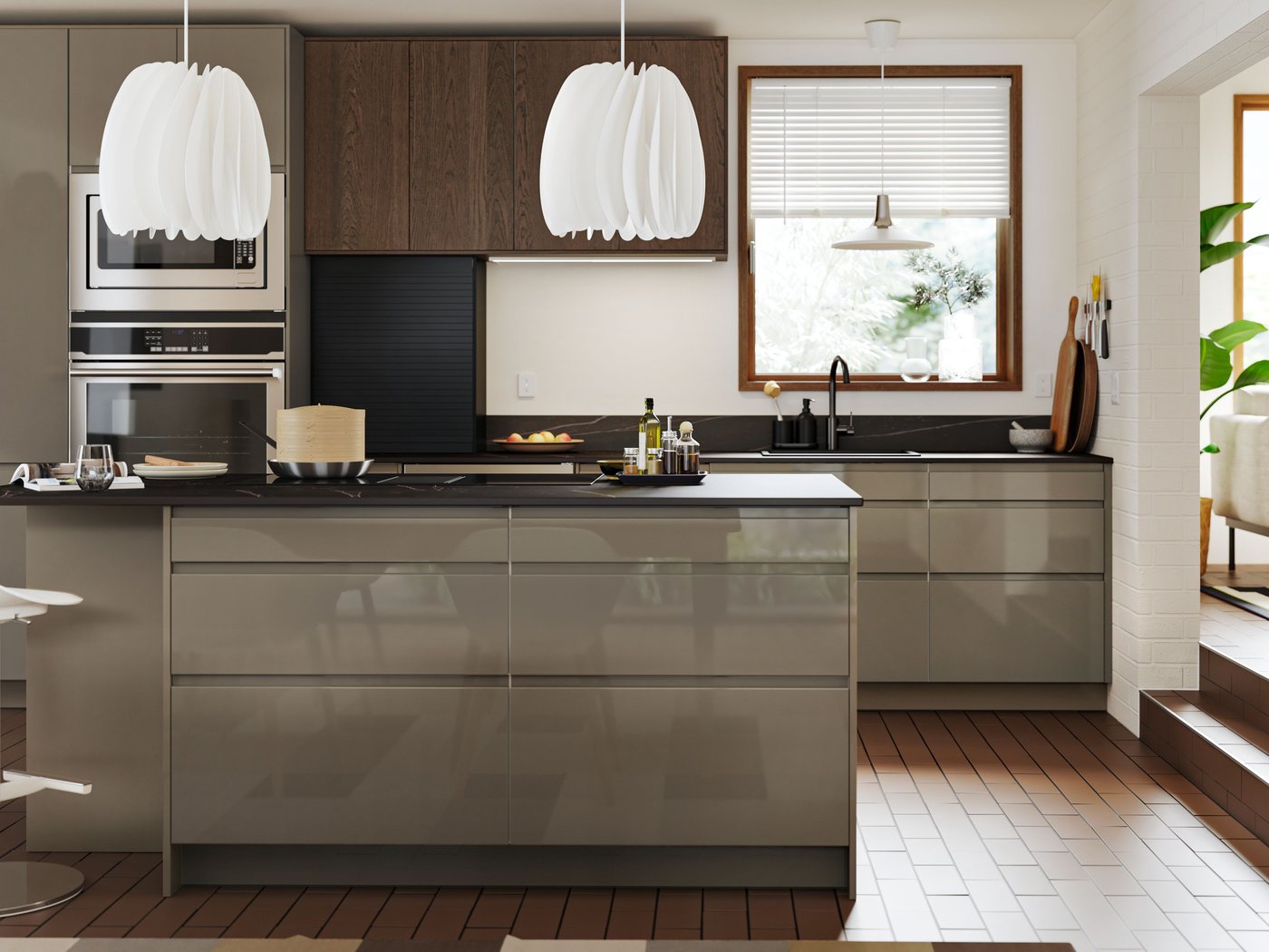 A white kitchen with a large kitchen island has cabinets with high-gloss dark grey-brown VOXTORP and brown SINARP fronts.