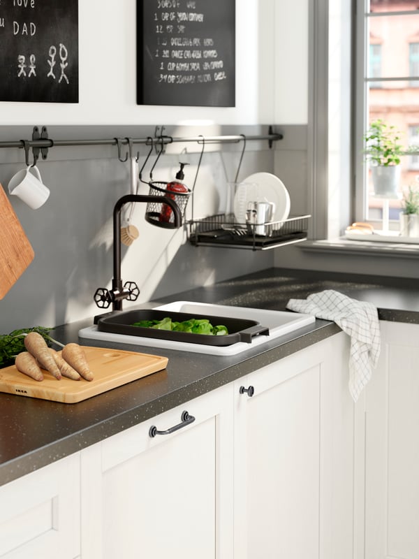 HAVSEN traditional white sink with black tap.