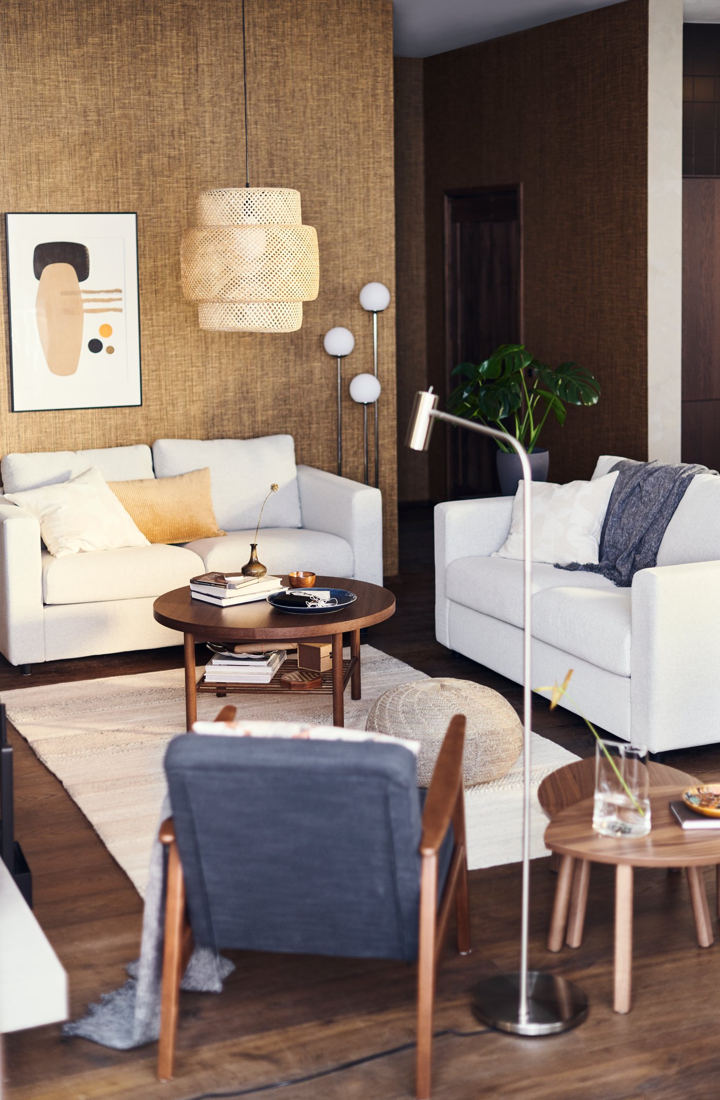 A walnut veneer STOCKHOLM nest of tables in the living room