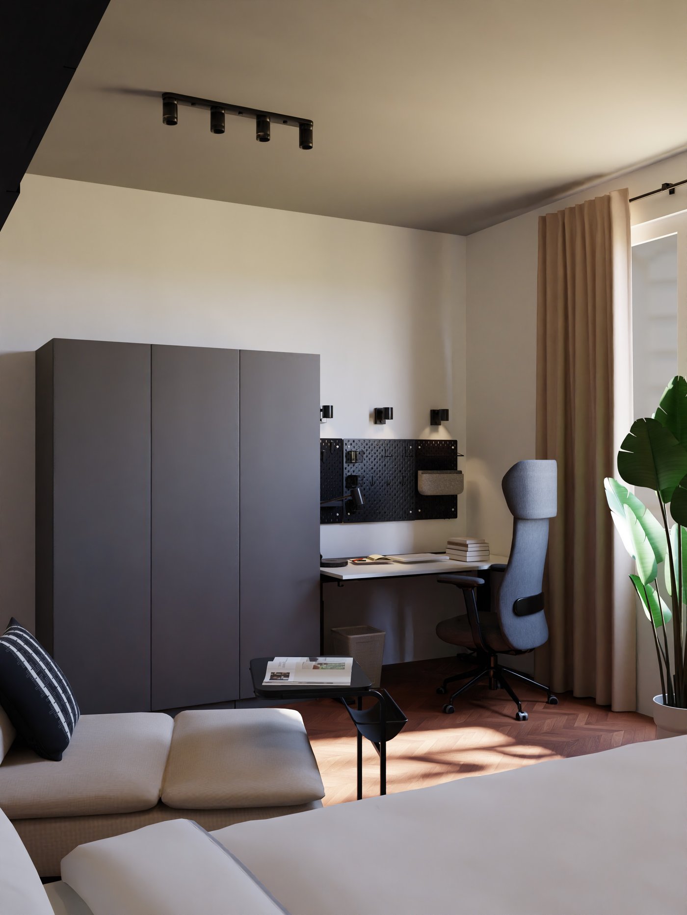 grauer Kleiderschrank mit schwarz weißem, höhenverstellbaren Schreibtisch und Scheibtischstuhl