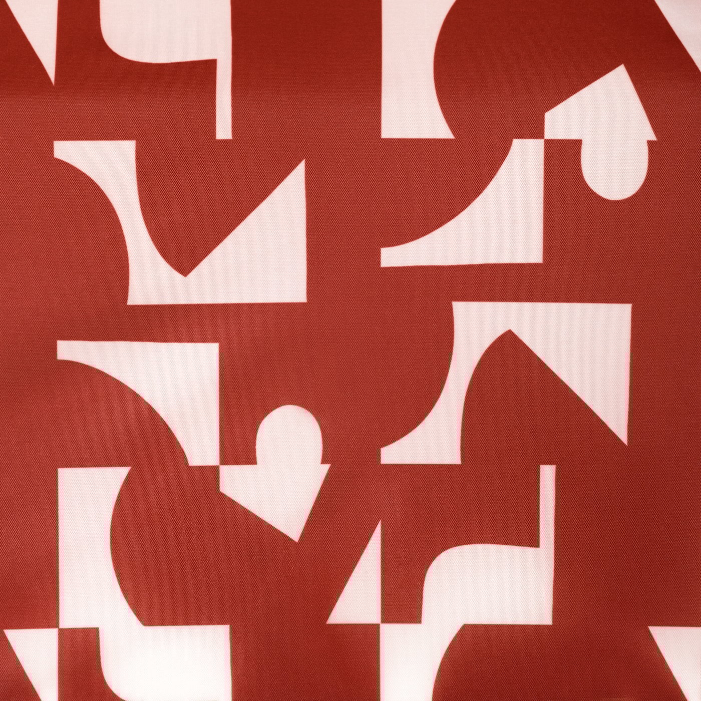 Približan posnetek vzorčaste tkanine odprtega rdeče-belega KNALLA zložljivega dežnika.