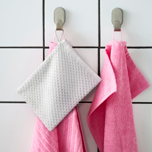 A pink VÅGSJÖN hand towel in the NA