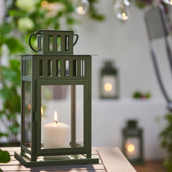 A green BORRBY lantern for pillar candle, in/out