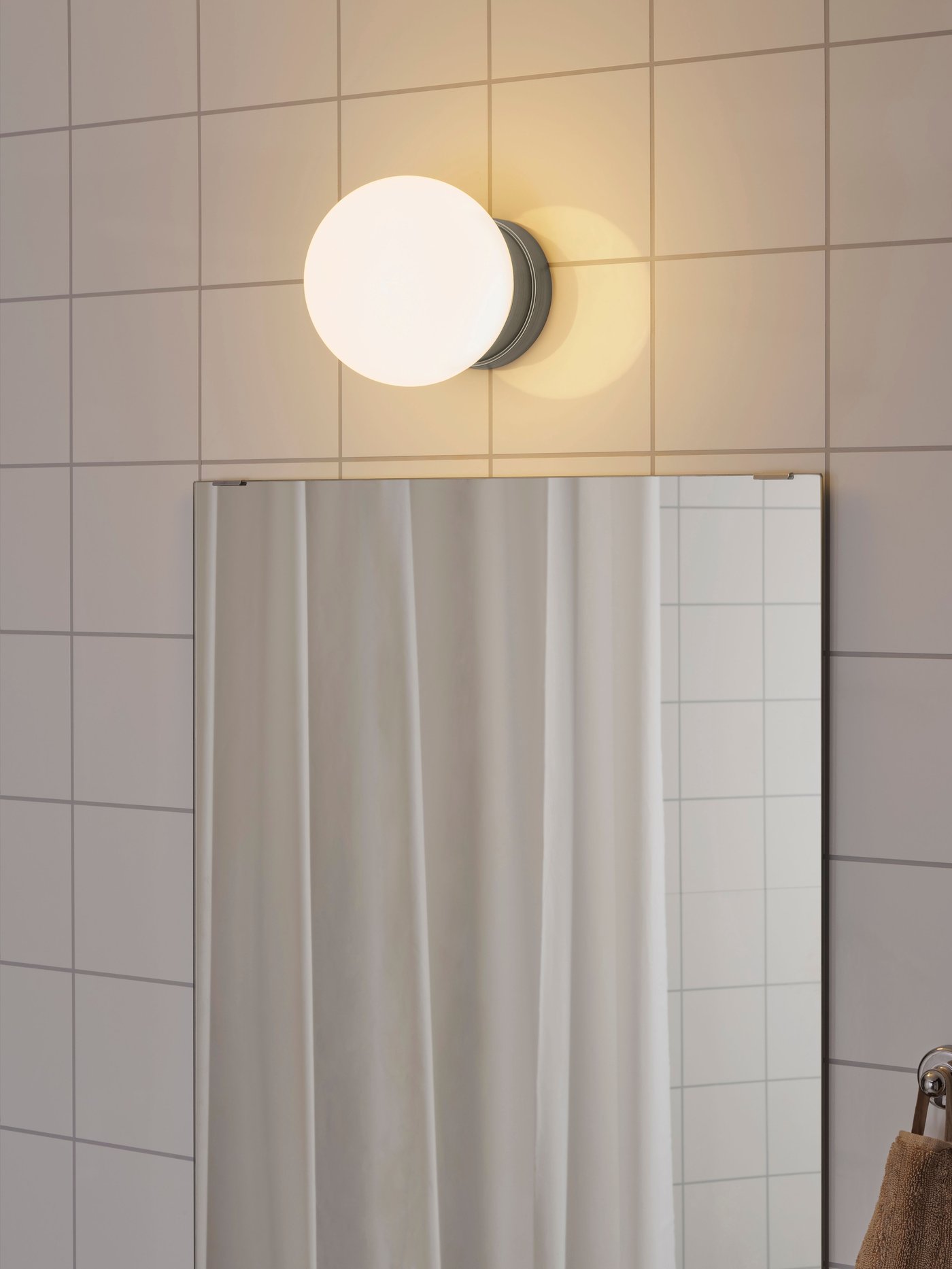 A stainless steel colour FRIHULT ceiling/wall lamp