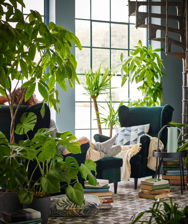 A Djuparp dark green STRANDMON footstool in the living room