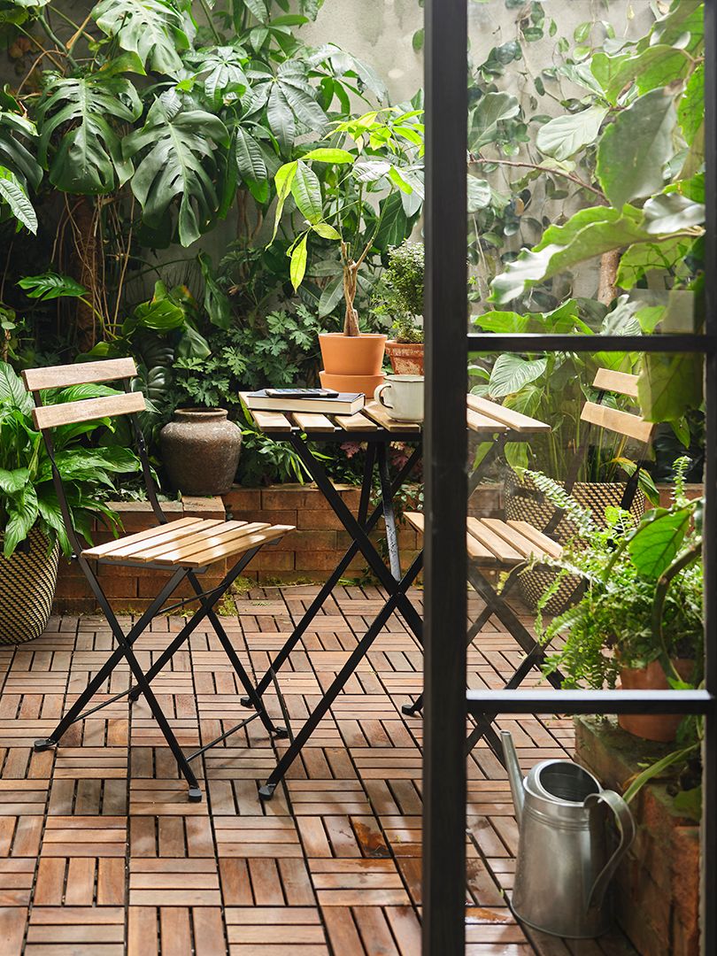 A black/light brown stained TÄRNÖ table, outdoor outside