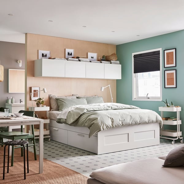 A white/Luröy BRIMNES bed frame with storage