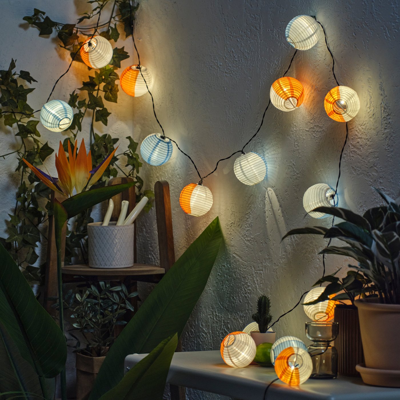 An outdoor solar-powered/globe multicolour SOLVINDEN LED lighting chain with 24 lights